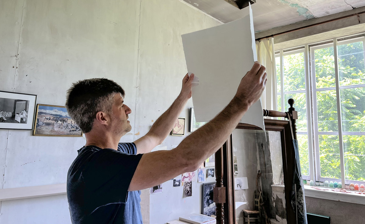 Prosek in an art studio making work